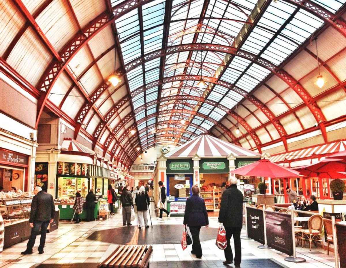 Interior of Grainger Market with traders and customers.